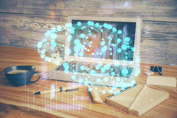 Double exposure of work space with computer and human brain drawing hologram. Brainstorm concept.