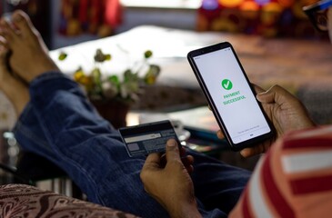 digital online payment made by an Indian person from smartphone at home