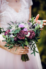 Wedding bouquet of the bride in women's hands. wedding flowers. Bridal bouquet of fresh flowers, wedding concept