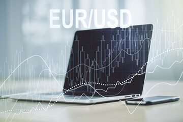 Creative concept of EURO USD financial chart illustration on modern laptop background. Trading and currency concept. Multiexposure