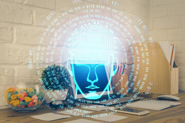 Double exposure of work space with computer and human brain drawing hologram. Brainstorm concept.