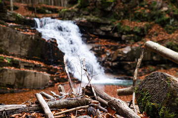 view of waterfall in autumn forest