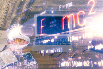 Desktop computer background and formula hologram writing. Double exposure. Education concept.