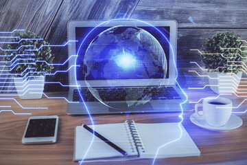 Multi exposure of work table with computer and brain hologram. Brainstorm concept.