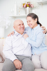 Fototapeta premium Romantic old couple together in room