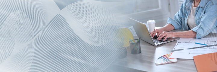 Female architect working on construction project; panoramic banner