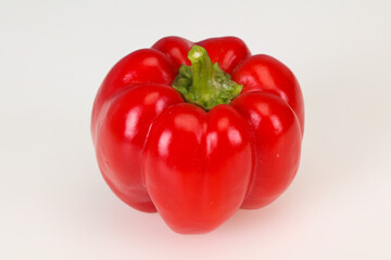 Ripe red bell pepper isolated on white