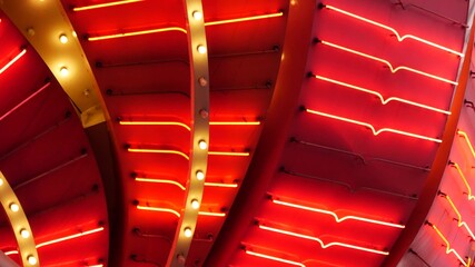 Old fasioned electric lamps blinking and glowing at night. Abstract close up of retro casino decoration shimmering in Las Vegas, USA. Illuminated vintage style bulbs glittering on Freemont street