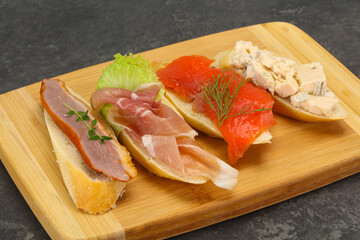 Tapas - bruschetta with prosciutto, salmon, duck and gorgonzola