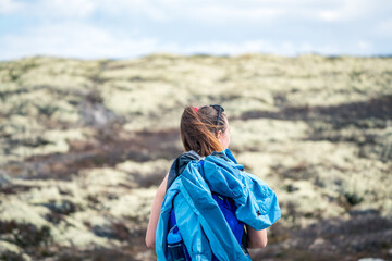 Female backpacker outdoors in nature.