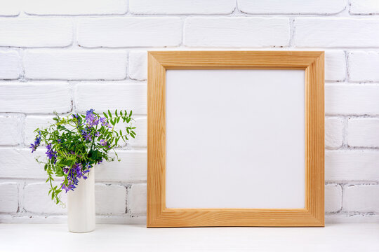  Square wooden picture frame mockup with bird vetch