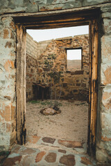 Door frame leading into the ruins of an old deserted building