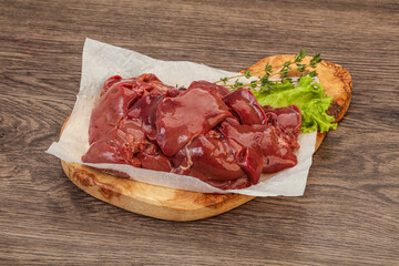 Raw chicken liver over board