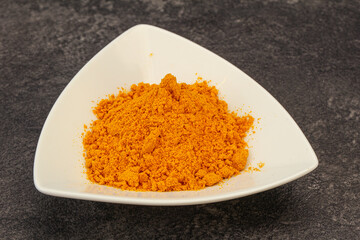 Tumeric powder in the bowl