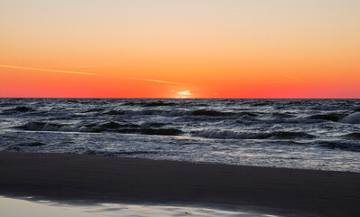 Sunset on the sea A beautiful summer day when the sun sets into the sea.