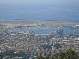 Genova, Italy – 07/30/2020: Beautiful scenic aerial view of the city, port, dam, sea, Cristoforo...