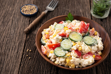 vegetable salad in wood plate food background