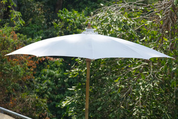 White umbrella in garden