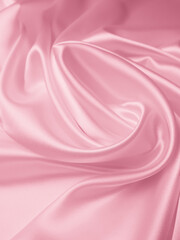 Beautiful elegant wavy light pink satin silk luxury cloth fabric texture, abstract background design. 