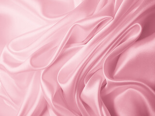 Beautiful elegant wavy light pink satin silk luxury cloth fabric texture, abstract background design. 