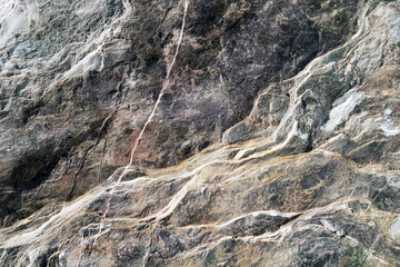 Close up view on a waved rough structure of split dolerite stone