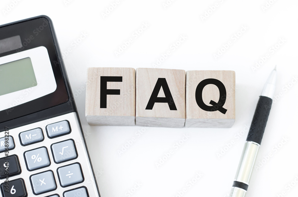 Poster concept of faq word on wooden cubes lying on white background with calculator and pen