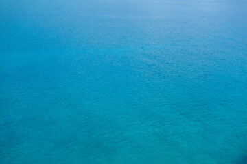 Blue surface of sea. Water is calm, just a little waves from breeze