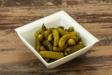Pickled gherkin in the bowl
