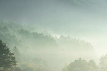 Beautiful misty morning dream valley mountain autumn fogy and clouds.