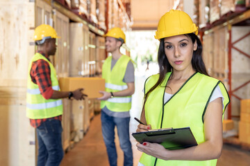 interracial Warehouse worker in distribution warehouse.