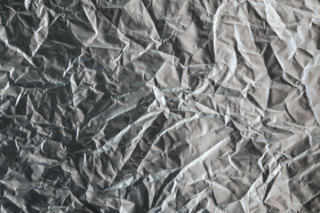 Shiny silver gray foil texture background industry.
