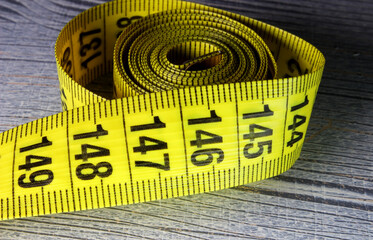 tape measure on a wooden background