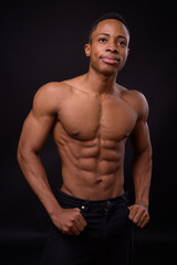 Fototapeta na wymiar Portrait of young handsome muscular African man shirtless