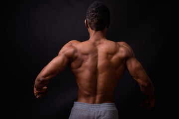 Fototapeta premium Portrait of young handsome muscular African man shirtless