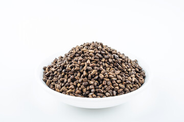 A saucer of cassia tea on white background