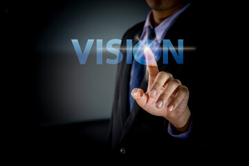 Businessman Hand touching VISION button, modern business technology concept