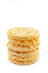 Corn round crispbread, crunchy multigrain cereal seeds isolated on white background, healthy eating