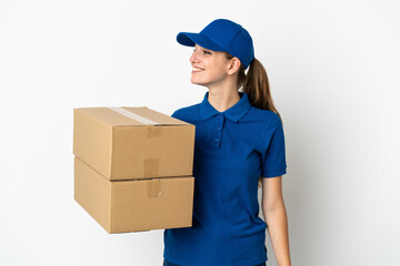 Young delivery woman isolated on white background looking side