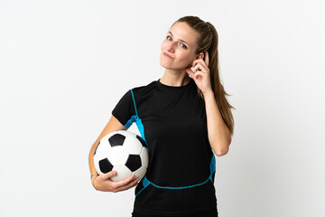 Young football player woman isolated on white background having doubts