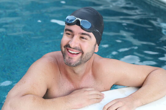 Handsome bearded male swimmer smiling 