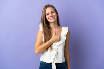 Young caucasian woman over isolated background giving a thumbs up gesture