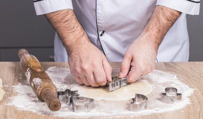 male cook preparing Christmas cookies