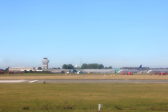 Denmark, Copenhagen airport:view of the airfield with the control tower, SAS aircrafts parked and empty runways at coronavirus time