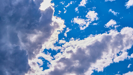 beautiful sun shines from behind the clouds. color