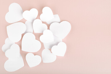Paper hearts on pink background