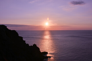 Sunrise in mediterranian sea near the town of Portbou, Cap de Creus, Catalonia, Spain