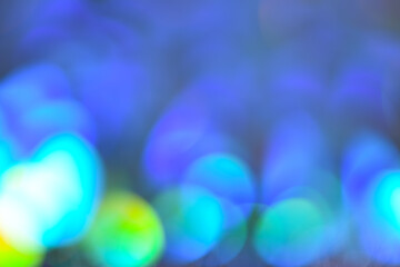 Blue defocused bokeh with green circles. Abstract blue bokeh background with green circles in a...