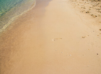 Footprints on sand at the beach