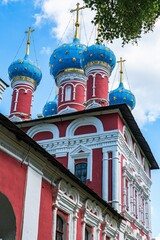 Fototapeta na wymiar Russia, Uglich, July 2020. Domes and crosses of an Orthodox cathedral as symbols of faith against the sky. 