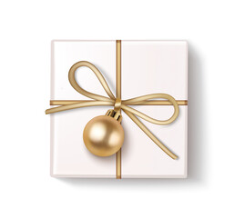 Decorative white gift box with golden ball isolated on white. Christmas and new year holiday decoration.
